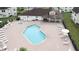 Community pool with plenty of lounge chairs and a hot tub at 5012 Laguna Bay Cir # 74, Kissimmee, FL 34746