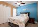 Bedroom with a ceiling fan, tiled floors and beach decor at 5012 Laguna Bay Cir # 74, Kissimmee, FL 34746