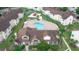 Aerial view of community pool, clubhouse, and surrounding buildings at 5012 Laguna Bay Cir # 74, Kissimmee, FL 34746