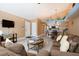 Spacious living room with vaulted ceilings, comfortable seating, and views to the kitchen and dining area at 5012 Laguna Bay Cir # 74, Kissimmee, FL 34746