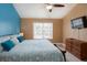 Spacious Primary bedroom with large bed, TV, and plenty of natural light at 5012 Laguna Bay Cir # 74, Kissimmee, FL 34746