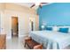 King size bed in a bright bedroom with access to the bathroom and closet at 5012 Laguna Bay Cir # 74, Kissimmee, FL 34746