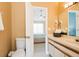 Bathroom with toilet and a view into another bedroom at 5012 Laguna Bay Cir # 74, Kissimmee, FL 34746