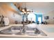 Kitchen features a large double sink with a view into the living room at 5012 Laguna Bay Cir # 74, Kissimmee, FL 34746