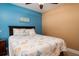 Bedroom with a ceiling fan, tiled floors and beach decor at 5012 Laguna Bay Cir # 74, Kissimmee, FL 34746