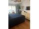Large main bedroom with a king-size bed, dresser and plenty of natural light at 8713 Sw Rockingham Ter # D, Kissimmee, FL 34747
