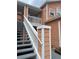 Exterior view of condo building showing peach colored building and stairs at 8713 Sw Rockingham Ter # D, Kissimmee, FL 34747