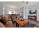 Open concept living room with kitchen and dining area views and a large TV at 2758 Sun Key Pl, Kissimmee, FL 34747