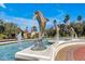 Elegant entrance to Emerald Island with dolphin fountains and lush landscaping at 2758 Sun Key Pl, Kissimmee, FL 34747