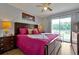 Spacious main bedroom with king-size bed and access to balcony at 2758 Sun Key Pl, Kissimmee, FL 34747