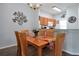 Bright dining room with wood table, six chairs, and kitchen access at 2758 Sun Key Pl, Kissimmee, FL 34747