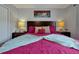 Bright bedroom with a king-size bed and wood nightstands at 2758 Sun Key Pl, Kissimmee, FL 34747