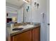 Vanity with sink, mirror, and hairdryer in a well lit bathroom at 2758 Sun Key Pl, Kissimmee, FL 34747