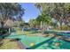 Fun mini golf course with lush landscaping and palm trees at 2758 Sun Key Pl, Kissimmee, FL 34747