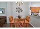 Charming dining area with wood table, six chairs, and wall art at 2758 Sun Key Pl, Kissimmee, FL 34747