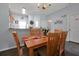 Well-lit dining room with wood table and kitchen views at 2758 Sun Key Pl, Kissimmee, FL 34747