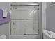 Clean bathroom with tub and shower combo and white tile at 2758 Sun Key Pl, Kissimmee, FL 34747