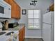 Well-equipped kitchen featuring granite countertops and modern appliances at 2758 Sun Key Pl, Kissimmee, FL 34747