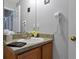 Vanity with sink, mirror and hairdryer in a well lit bathroom at 2758 Sun Key Pl, Kissimmee, FL 34747