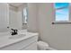 Bathroom with white vanity, toilet, and shower at 4063 Bannock Ave, Tavares, FL 32778