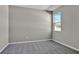 Simple bedroom with gray walls and gray carpeting at 4063 Bannock Ave, Tavares, FL 32778