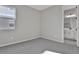 Bedroom with grey carpet and access to bathroom at 4063 Bannock Ave, Tavares, FL 32778