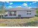 Rear view of house with covered patio at 4063 Bannock Ave, Tavares, FL 32778