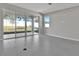 Living area with sliding glass doors leading to the backyard at 4063 Bannock Ave, Tavares, FL 32778