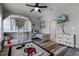 Bedroom with bunk beds, Mickey Mouse rug, and plenty of storage at 7714 Excitement Dr, Reunion, FL 34747
