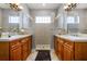 Double vanity bathroom with a large shower and neutral tile at 7714 Excitement Dr, Reunion, FL 34747