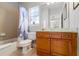 Bathroom with tub, shower, and wood vanity at 7714 Excitement Dr, Reunion, FL 34747