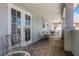 Covered balcony with tiled floor and seating at 7714 Excitement Dr, Reunion, FL 34747