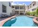 Large kidney shaped pool with patio at 7714 Excitement Dr, Reunion, FL 34747