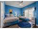 Bedroom with twin and full-size beds, a tv and minion decor at 7714 Excitement Dr, Reunion, FL 34747