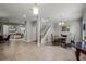 Open dining room with tile floors and a view of the living room at 7714 Excitement Dr, Reunion, FL 34747