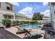 Relaxing pool area with lounge chairs at 7714 Excitement Dr, Reunion, FL 34747
