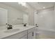 Double vanity bathroom with window and tub at 180 Flag Lilly Ln, Umatilla, FL 32784