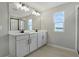 Double vanity bathroom with window and shower at 180 Flag Lilly Ln, Umatilla, FL 32784