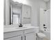 Bathroom with white vanity, bathtub and shower at 180 Flag Lilly Ln, Umatilla, FL 32784