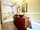 Bathroom with double vanity and walk-in shower at 2086 Camelot Blvd, St Cloud, FL 34772