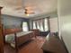 Main bedroom with wood flooring and window coverings at 2086 Camelot Blvd, St Cloud, FL 34772