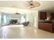 Spacious living room with tile floors and a fireplace at 2086 Camelot Blvd, St Cloud, FL 34772