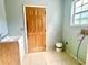 Small laundry room with a sink and built-in cabinets at 2086 Camelot Blvd, St Cloud, FL 34772