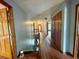 Upper level hallway with wood flooring and access to bedrooms at 2086 Camelot Blvd, St Cloud, FL 34772