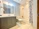 Bathroom with shower/tub combo and gray vanity at 2086 Camelot Blvd, St Cloud, FL 34772
