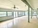 Bright sunroom with multiple windows and ceiling fans at 2086 Camelot Blvd, St Cloud, FL 34772