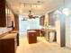 Kitchen with island and dark wood cabinets at 2086 Camelot Blvd, St Cloud, FL 34772