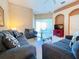 Living room with comfortable seating, a flat screen TV, and access to a patio at 648 Copeland Dr, Haines City, FL 33844