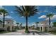 Gated community entrance with attractive landscaping and Mediterranean style architecture at 648 Copeland Dr, Haines City, FL 33844