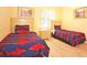 Bedroom with two twin beds featuring shark bedding at 648 Copeland Dr, Haines City, FL 33844